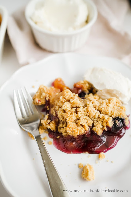 This gorgeous Peach and Blueberry Crisp will be perfect for any summer party! The recipe uses fresh fruit and is super easy! | mynameissnickerdoodle.com