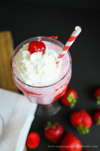 This Strawberry Bliss would be perfect for summertime or a yummy and flirty dessert for Valentine's Day! Topped with whipped cream and a cherry! | mynameissnickerdoodle.com