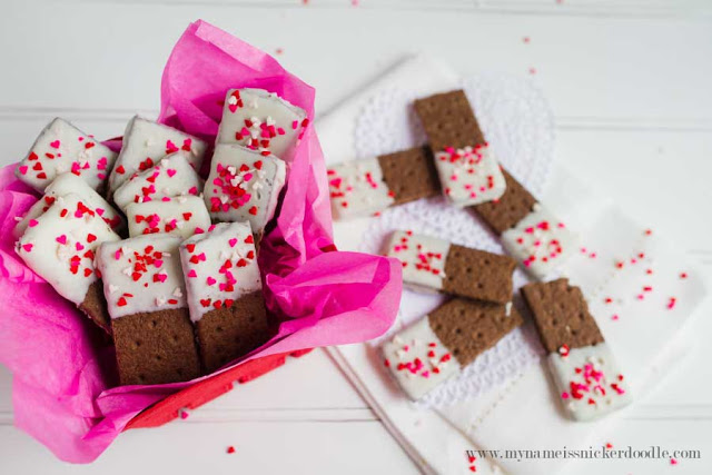 These Valentine Graham Cracker Cookie Sticks are completely easy to make and totally adorable! A perfect little treat. There's a surprising ingredient, too! Find the how to at mynameissnickerdoodle.com