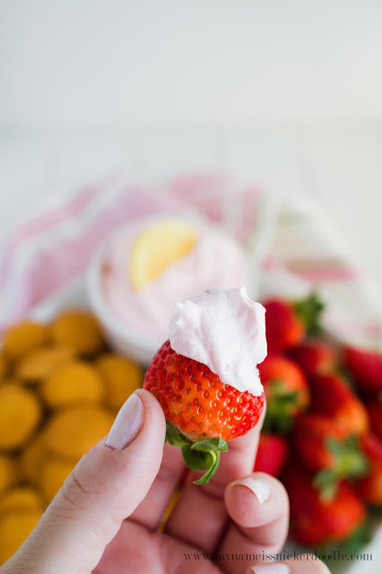 This perfect fruit dip is made with two ingredients and tastes just like Strawberry Lemonade! SO YUMMY and pink! | mynameissnickerdoodle.com