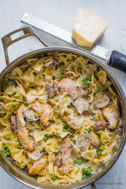 Here is a tasty recipe for One Pan Chicken and Peas Creamy Pasta. Comes together in under 30 minutes and perfect for a weeknight meal! | mynameissnickerdoodle.com