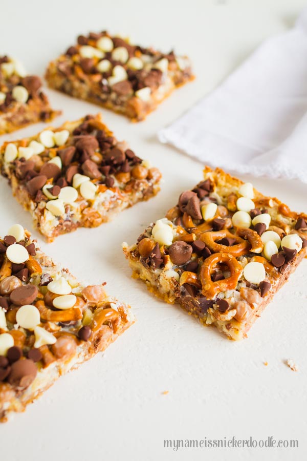 Here is a twist on the classic Magic Cookie Bars recipe. These Magic Caramel Pretzel Cookie Bars are the perfect salty sweet treat! | mynameissnickerdoodle.com