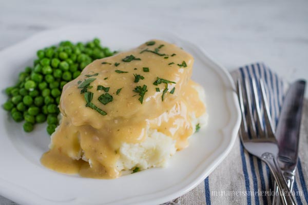 Smothered Pork Chops made easily in the slow cooker! Super simply and delicious! | mynameissnickerdoodle.com