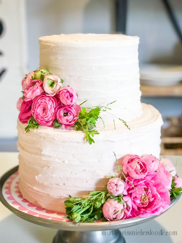 Gorgeous buttercream and chocoalte cake! Love these ranuculus flowers! | mynameissnickerdoodle.com
