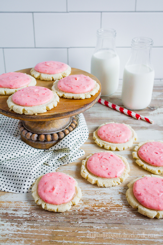 Strawberries and Cream Sugar Cookies! An updated sugar cookie recipe frosted with a fresh strawberry butter cream frosting! | mynameissnickerdoodle.com