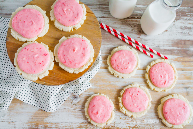 Strawberries and Cream Sugar Cookies! An updated sugar cookie recipe frosted with a fresh strawberry butter cream frosting! | mynameissnickerdoodle.com